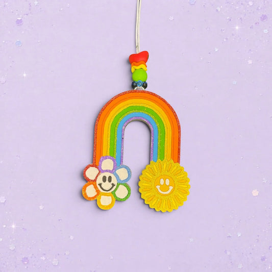 BeFreshie rainbow car freshie with a smiley flower and sun, featuring a Fruit Loops scent and colorful beads.