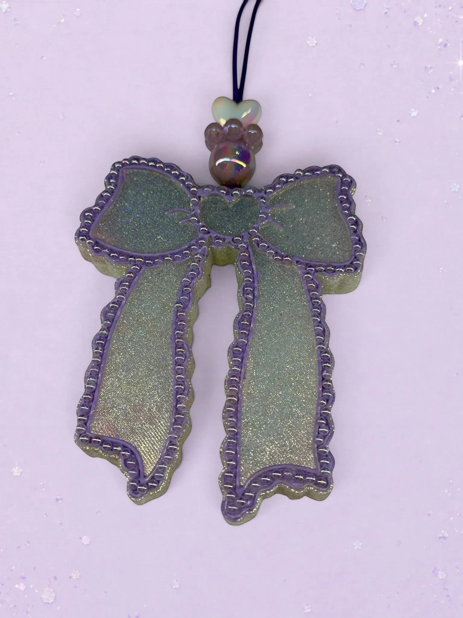 BeFreshie Scallop Bow long tails car freshie in shimmering iridescent green and purple with decorative bead accent