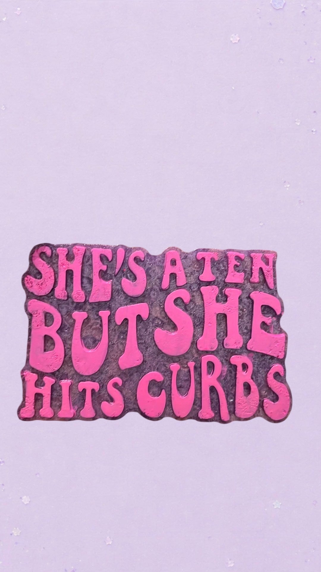 BeFreshie purple and pink novelty car air freshener with "She's A Ten But She Hits Curbs" text.