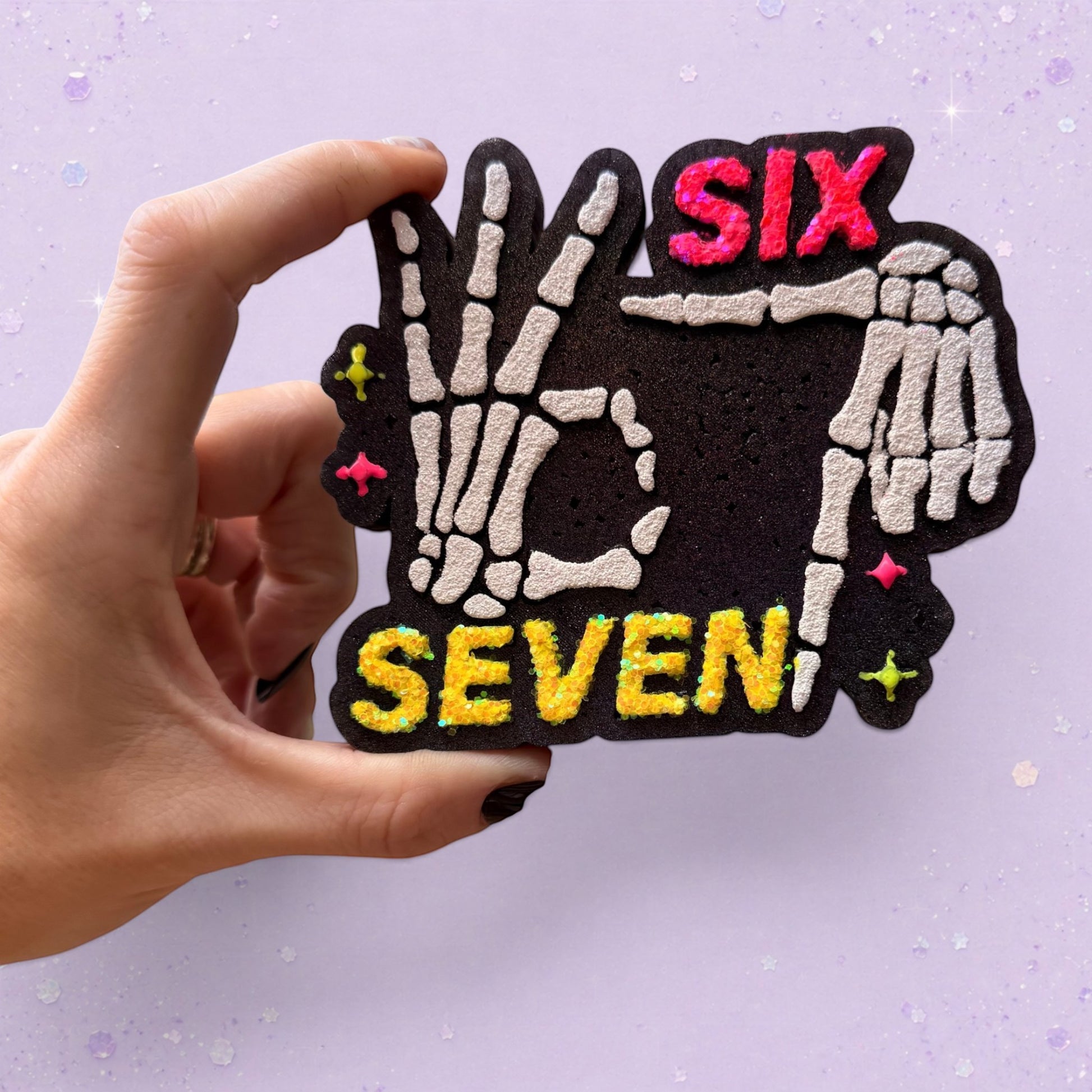 BeFreshie Six Seven car air freshener featuring skeleton hands making a hand sign with neon pink and yellow text
