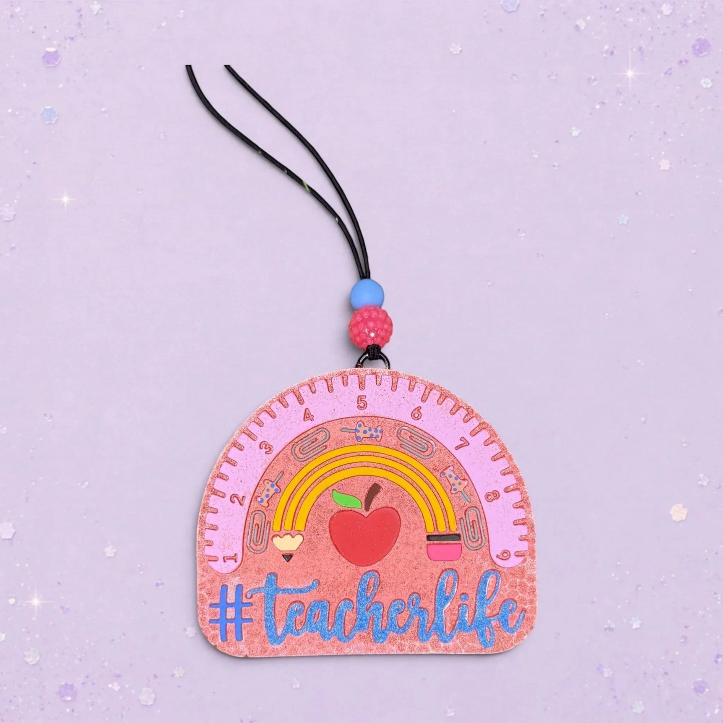 BeFreshie #Teacherlife freshie shaped like a pink ruler with a rainbow, apple, and school supplies. A fun teacher gift.