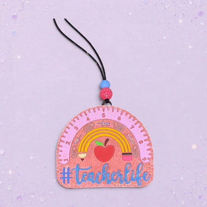 BeFreshie #Teacherlife freshie shaped like a pink ruler with a rainbow, apple, and school supplies. A fun teacher gift.
