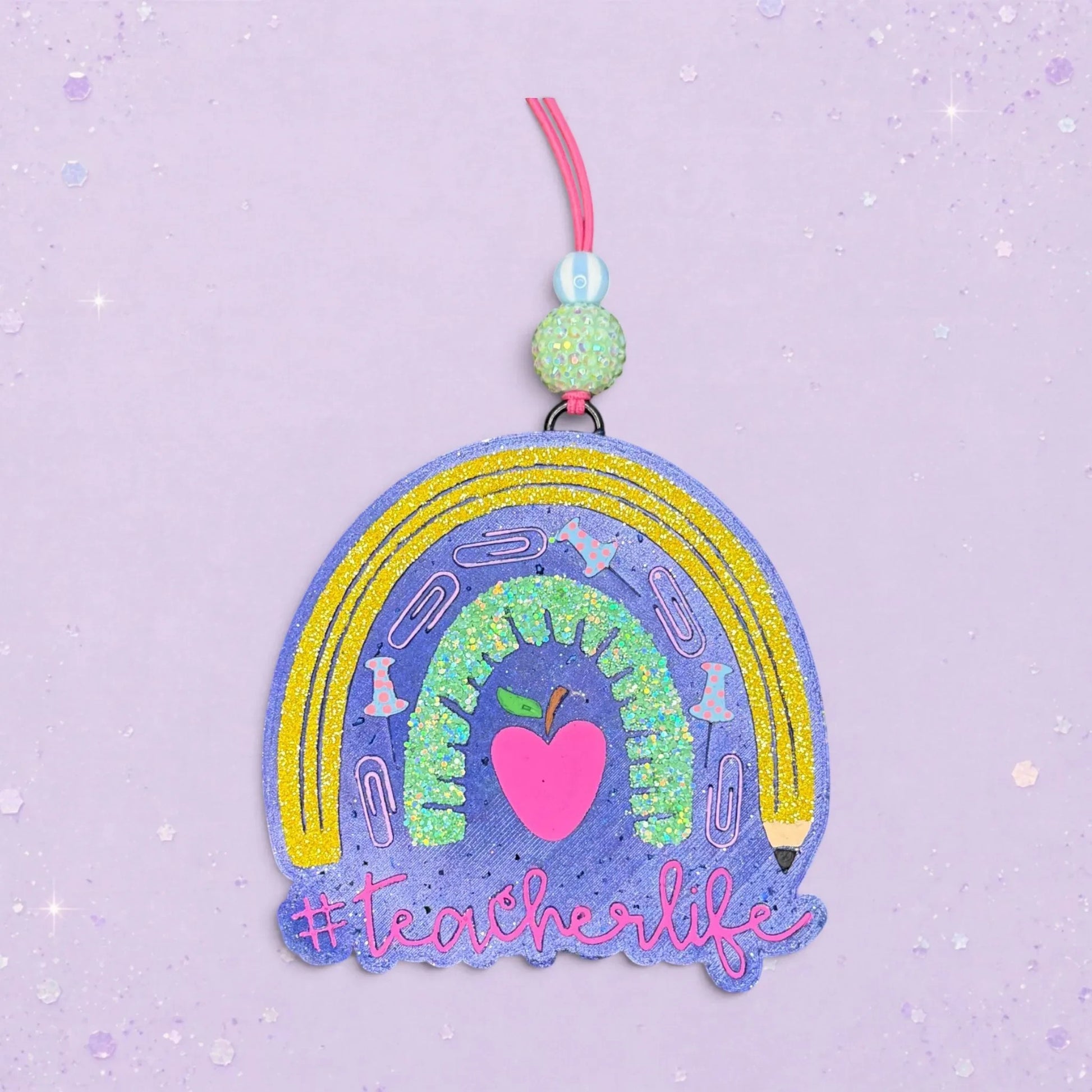 BeFreshie #Teacherlife rainbow freshie with glitter, paper clips, push pins, and a pink heart apple.