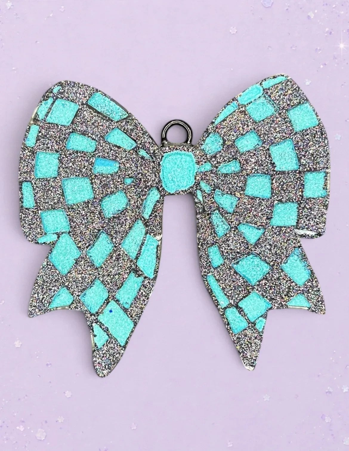 BeFreshie checkered bow car freshie in teal and silver glitter on a light purple background