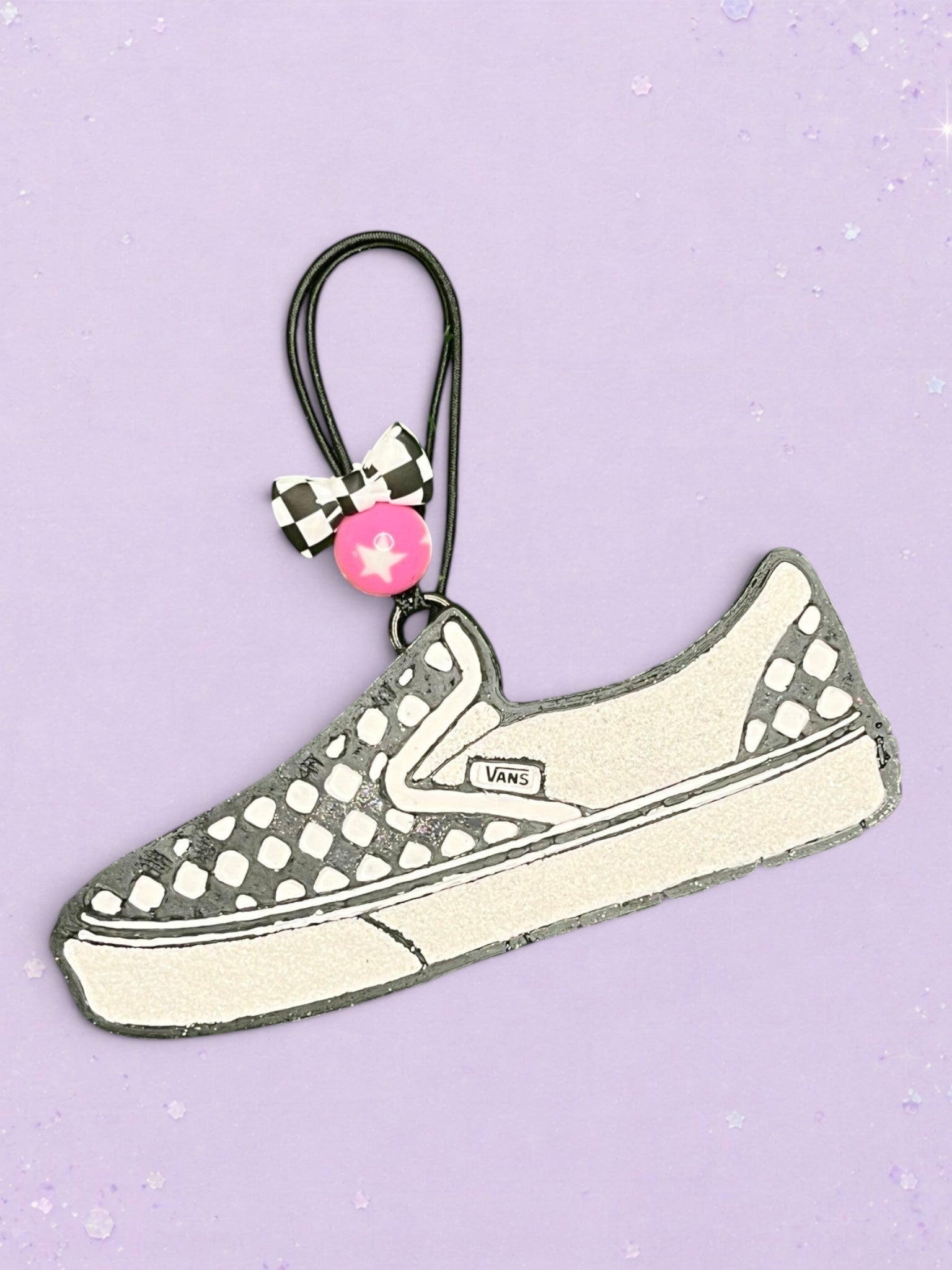 BeFreshie Van freshie car air freshener shaped like a checkered slip-on sneaker with a black and white bow charm.